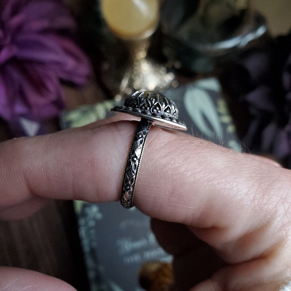 a person holding a ring in their hand