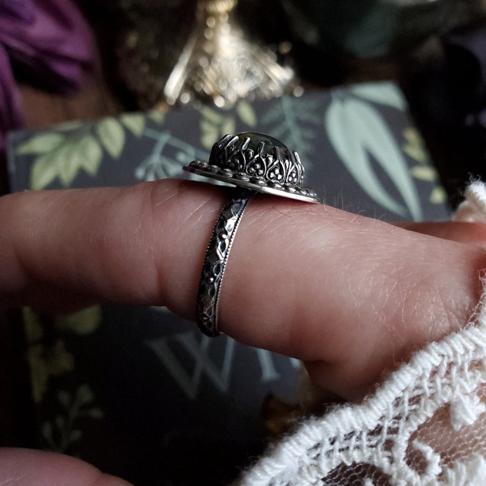 a person is holding a ring in their hand
