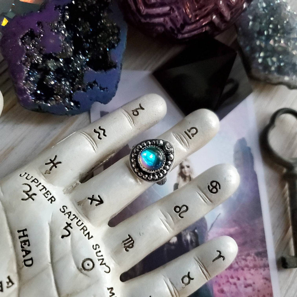 a hand with a ring on it