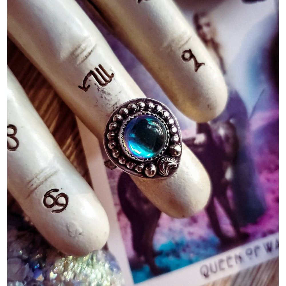 a ring with a blue stone on it