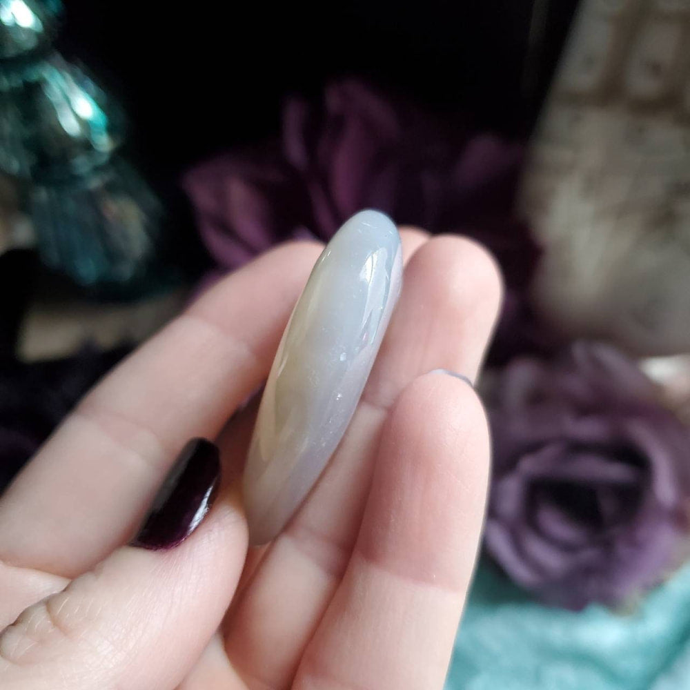 a person holding a white and black mani