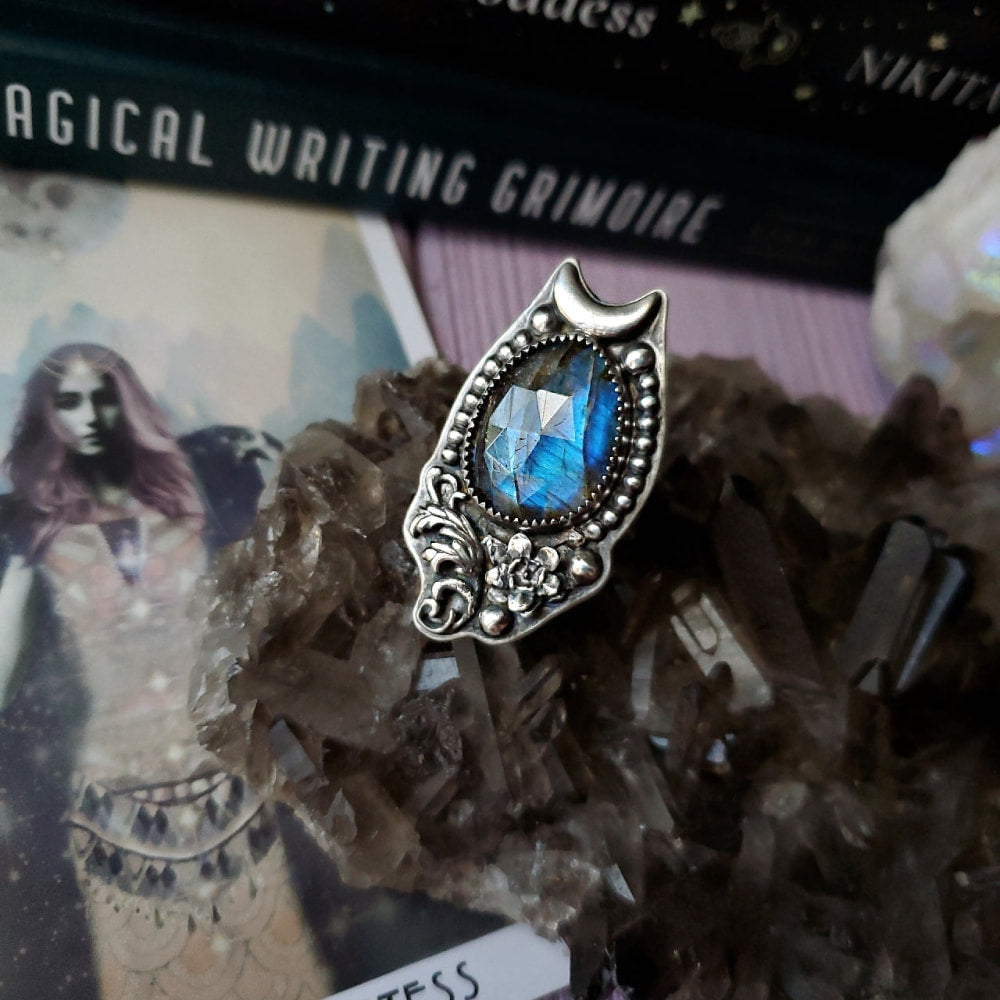 a ring with a blue stone in it