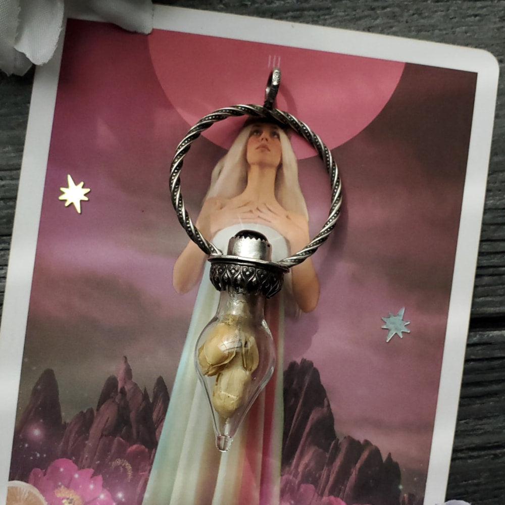 a woman holding a silver ring