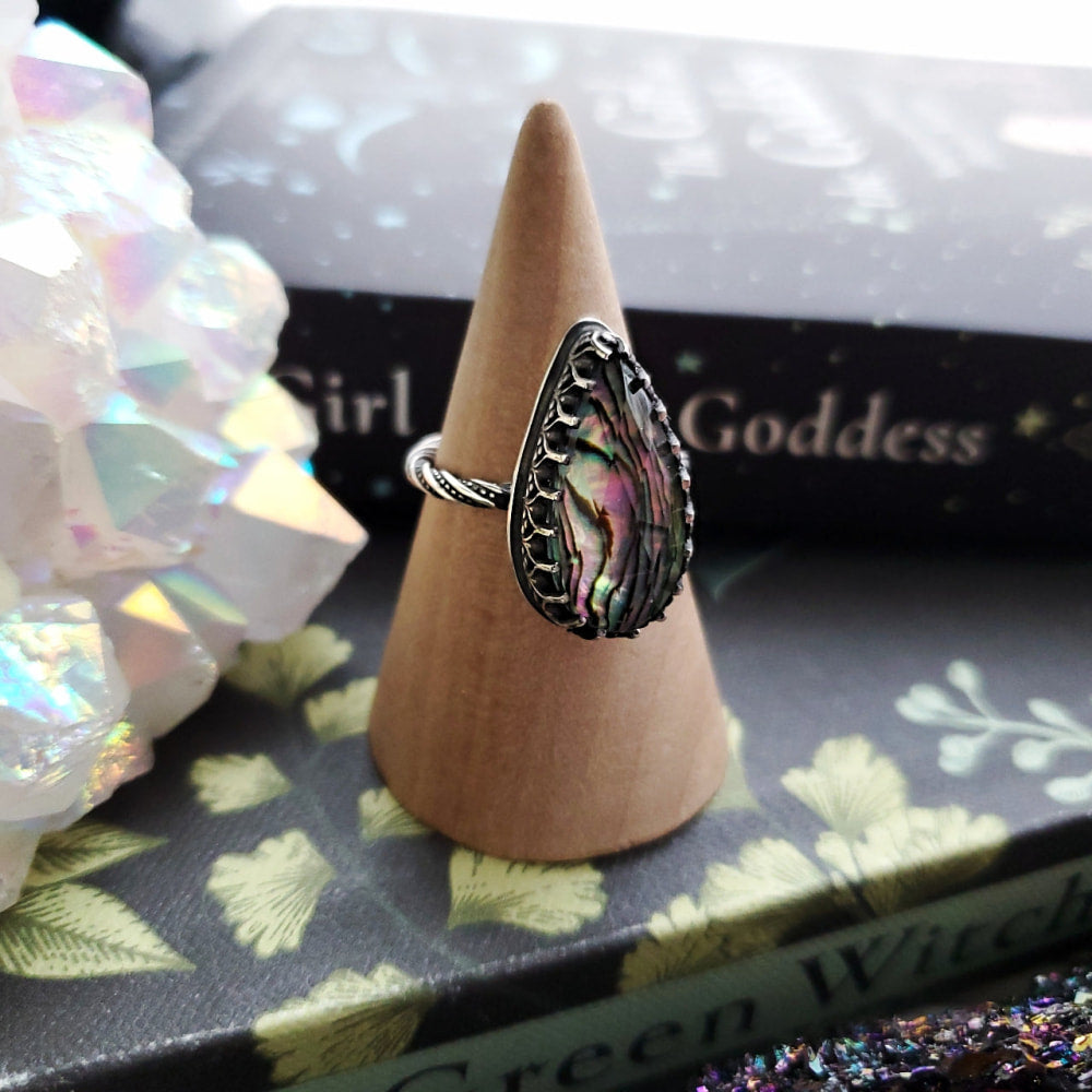 a ring with a pink stone in the middle