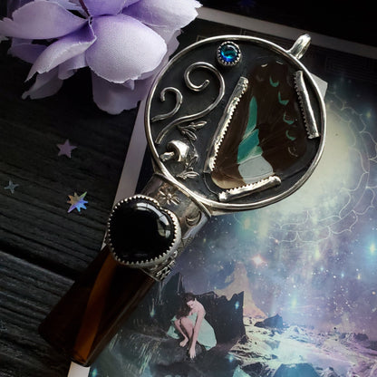 there is a magnifying glass with a picture of a woman in a dress